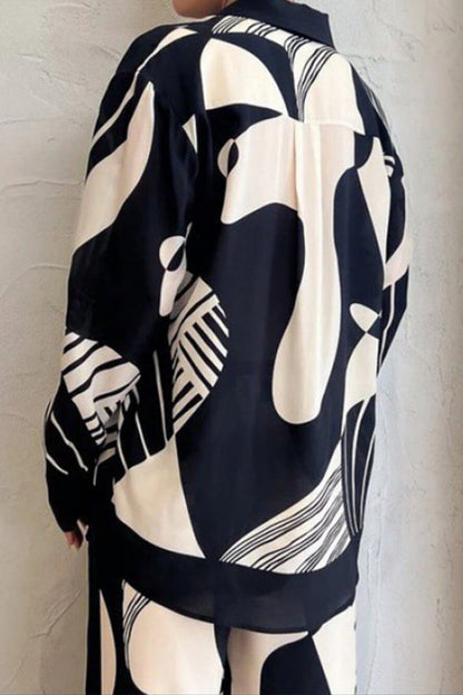 Trendy broekenset met losse wijde pijpen en graffitiprint